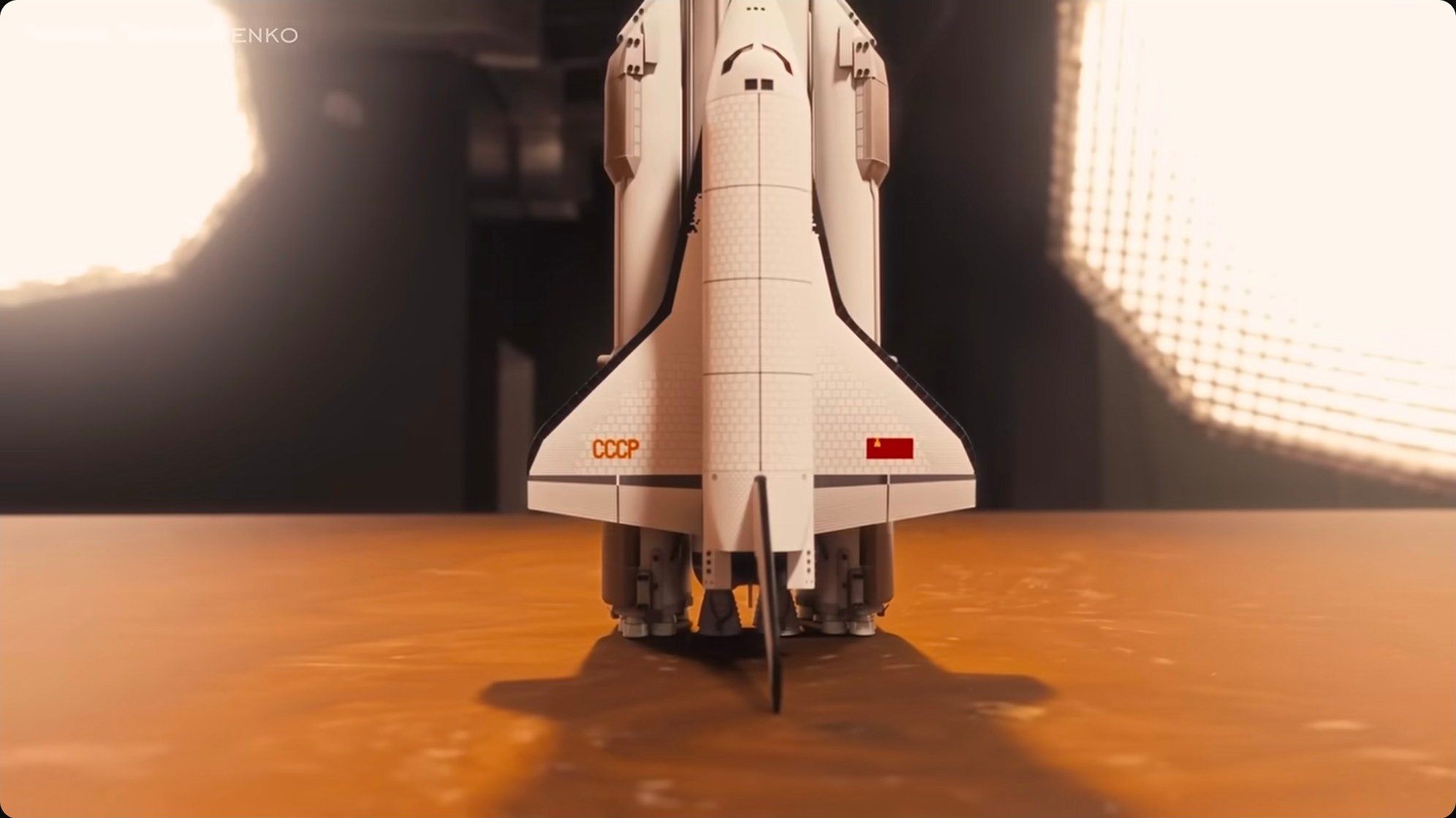 A rendered view of an Energia-Buran stack on the pad. The orbiter is side-mounted to the core tank, with four liquid-fueled strap-on boosters providing the bulk of liftoff thrust.